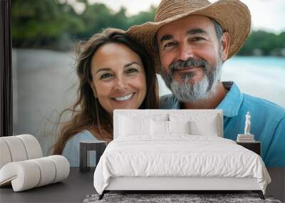 Close up portrait of mature couple on the beach feeling happy during vacation Wall mural