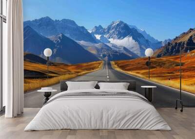 Empty highway between mountain peaks, clear sunny day, incredible nature, bright saturated colors Wall mural