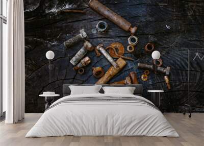 Set of rusty screws, nuts and small tools on a dark wooden backg Wall mural