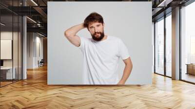 bearded man in white t-shirt posing Wall mural