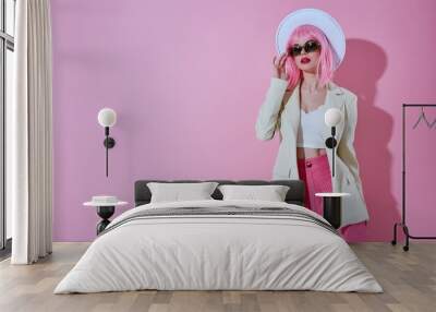 Beautiful fashionable girl hat with sunglasses fashion color background unaltered Wall mural