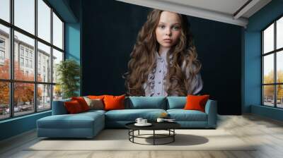 Beautiful little girl in luxury dress hairstyle Studio Wall mural