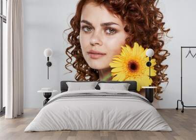 Beautiful woman curly hair flower Wall mural