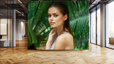 Beautiful women naked shoulders green leaves Exotic tropics Wall mural