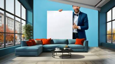 business man holding blank board Wall mural