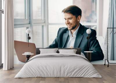 businessman sitting at desk in office Wall mural