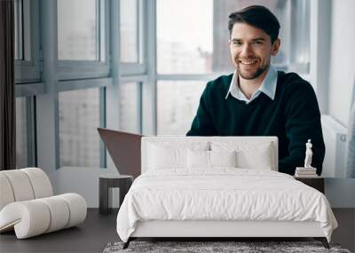 businessman working on laptop in office Wall mural