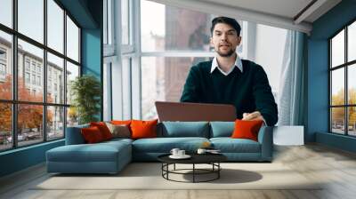 businessman working on laptop in office Wall mural