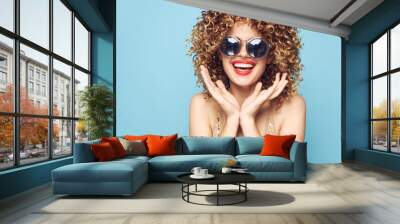 Cheerful woman Fun red lips curly hair lifestyle blue background decoration  Wall mural