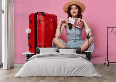 cheerful woman it is with a suitcase in a hat tourism travel passenger Wall mural