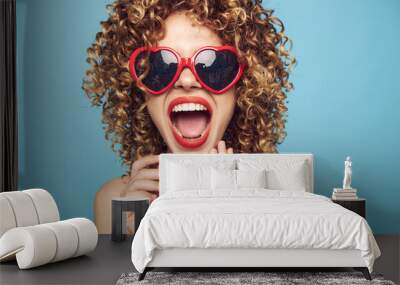 Cheerful woman Wearing dark glasses red lips open mouth look forward  Wall mural