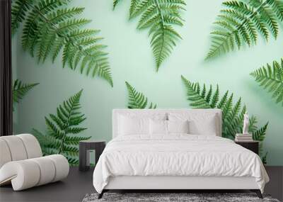 Circle of Green Fern Leaves on Light Green Background, Top View Botanical Nature Background Concept with Copy Space Wall mural