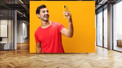 Copy man cyberspace portrait message communication smiling happy space studio yellow technology phone smartphone phone mobile Wall mural