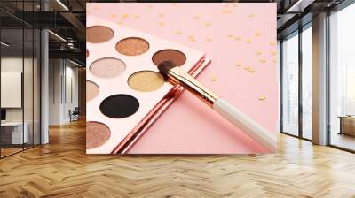 eyeshadow makeup brushes collection professional cosmetics accessories on pink background Wall mural