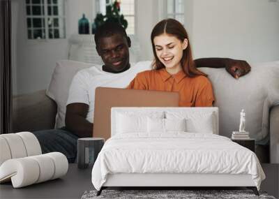 happy couple with laptop Wall mural