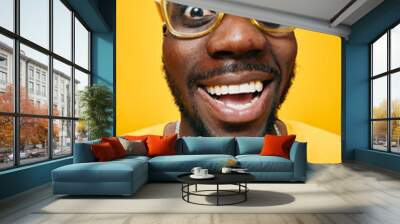 happy man with glasses, yellow background, smiling expression, joyful mood, close up portrait of an African descent male in casual clothing, vibrant colors, energetic vibes, positive atmosphere Wall mural