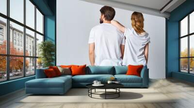 man and woman in white t-shirts and jeans design casual clothing mockup Wall mural