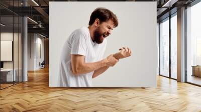 man bruised arm dislocated pain Wall mural