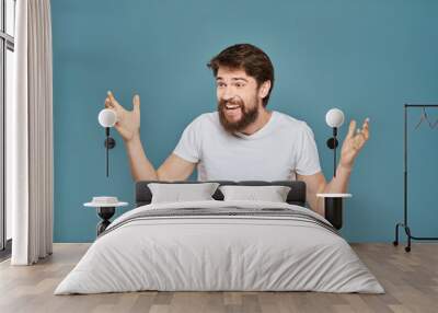 man in white t-shirt gesturing with his hands studio cropped Wall mural