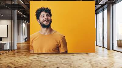 Man person studio guy young happy face confident portrait positive adult background look yellow expression Wall mural