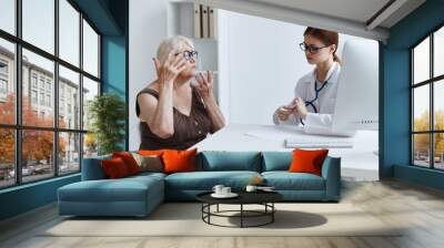 old woman patient talking to a doctor health care Wall mural