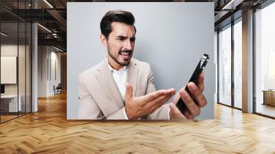 portrait man business hold suit smile phone happy call gray smartphone Wall mural