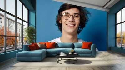 portrait of young man in glasses Wall mural