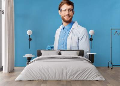 portrait of young man with arms crossed Wall mural