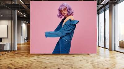 Positive young woman purple hair fashion glasses denim clothing color background unaltered Wall mural