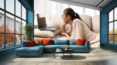 Smiling Woman, Typing on Laptop in Cozy Living Room: Modern Freelance Lifestyle Wall mural