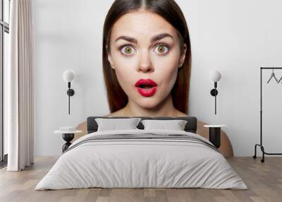 Surprised woman with red lips open mouth nude shoulders  Wall mural