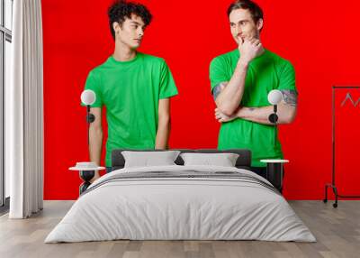 two friends in green t-shirts communication friendship positive Wall mural