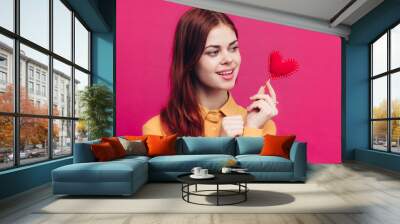 valentines day woman with heart on stick on pink background cropped view Wall mural