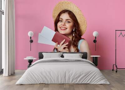 woman with hat passport and plane ticket airport passenger pink background Wall mural