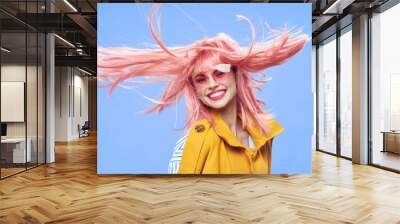 woman with pink hair smile glasses yellow coat elegant style  Wall mural