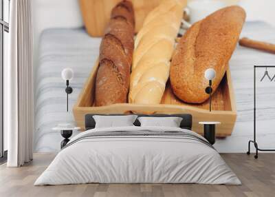 wooden tray with a loaf and two baguettes Wall mural