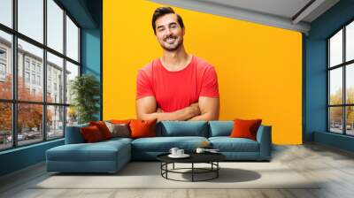 Yellow man background style confident studio copy space laughing gesture fashion arm trendy lifestyle portrait smiling Wall mural