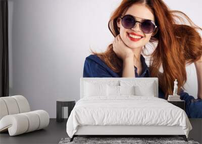 Young beautiful woman in sunglasses on a white background, fashion, beauty, style Wall mural