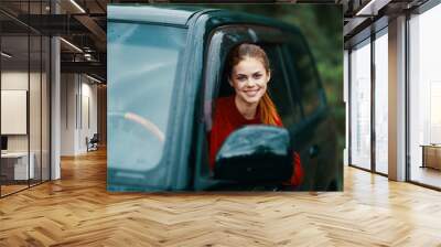 young woman in car Wall mural