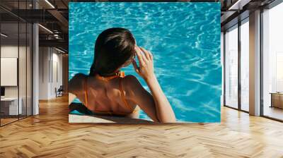 young woman in swimming pool Wall mural