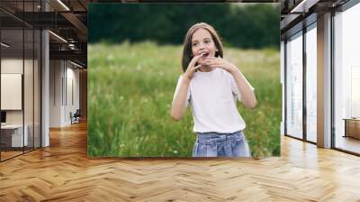 young woman talking on cell phone Wall mural