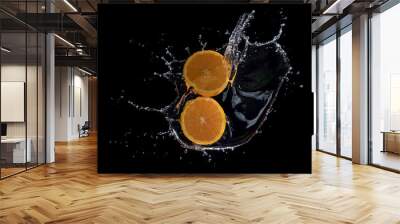 Fresh oranges with water splashes against black background Wall mural