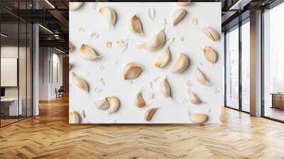 Assortment of garlic bulbs and slices arranged on a white surface for a visually striking display Wall mural