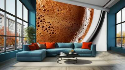 Close-up of steaming black coffee with frothy foam in cozy mug, exuding rich aroma and invigorating caffeine kick Wall mural