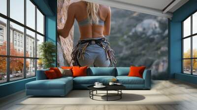 young woman climber on rock back view Generative AI Wall mural