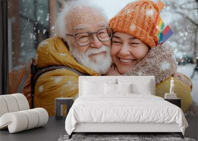 A man and a woman are hugging each other in the snow Wall mural