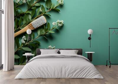 Eco-friendly bamboo toothbrushes and eucalyptus leaf on green background. Natural organic bathroom beauty product concept. Flat lay, top view, copy space. Natural bamboo toothbrush green background Wall mural