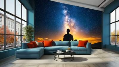 Man Meditating Under Starry Night Sky with Milky Way Wall mural