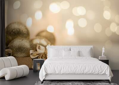 Box with golden christmas ball on golden star bokeh background Wall mural