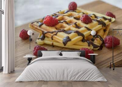 Two Viennese waffles with chocolate and berries on a wooden Board Wall mural